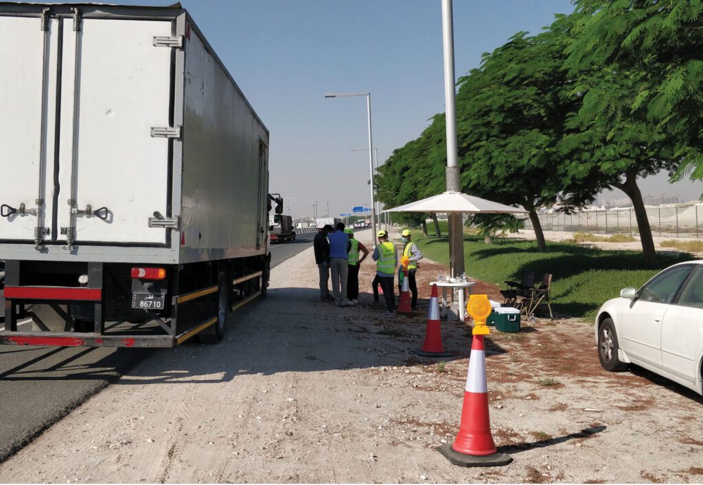 a white truck parked on the side of the road.