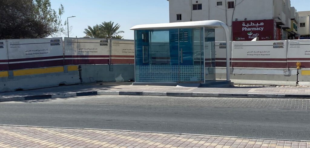 a bus stop on the side of a street.