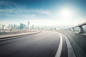 an image of a highway with a city in the background.