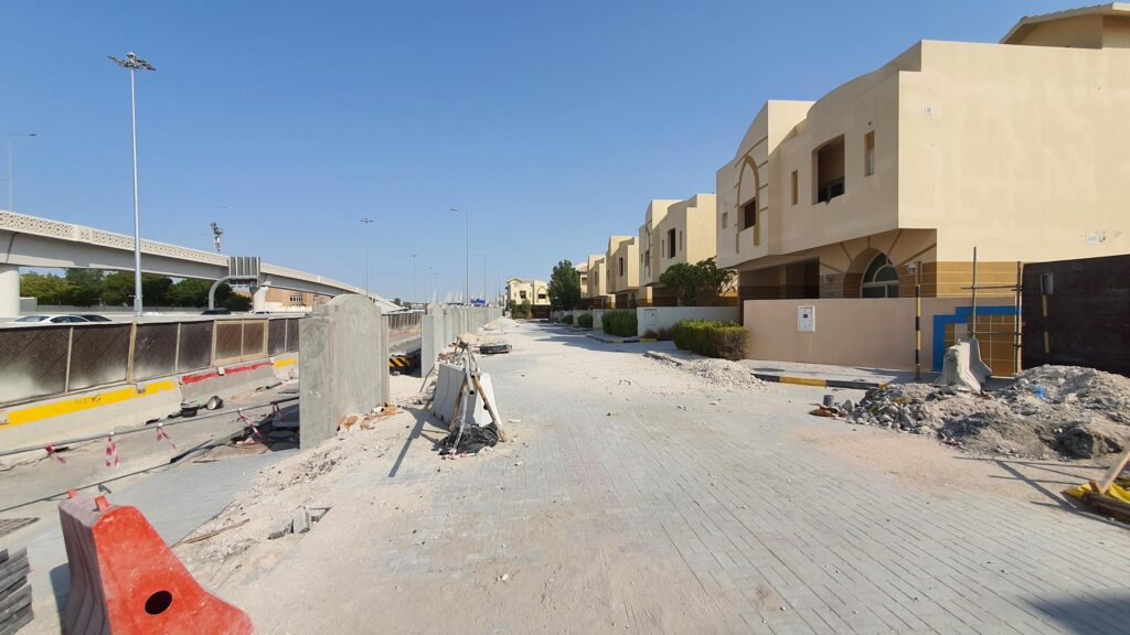 a street in a residential area is under construction.