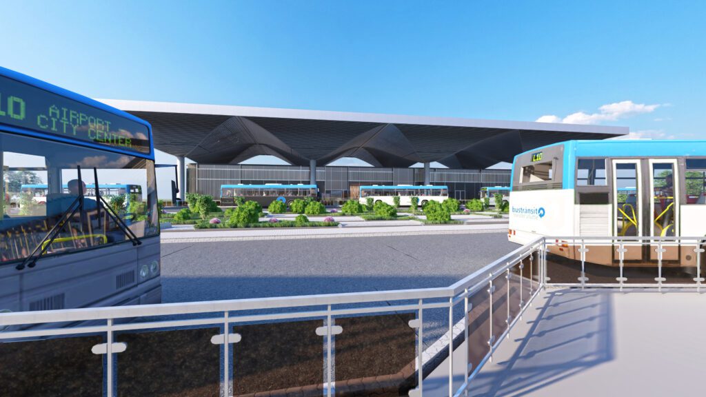 a blue and white bus is parked in front of a building.