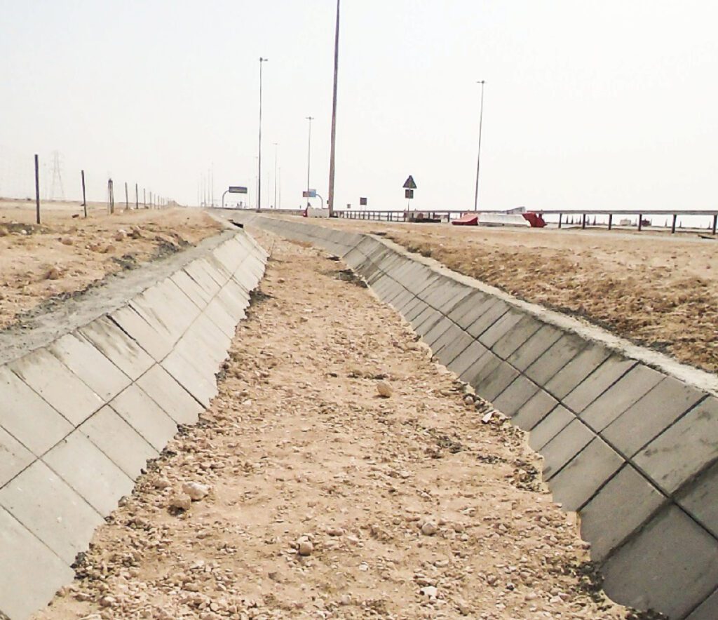 a road with a concrete wall in the middle of it.