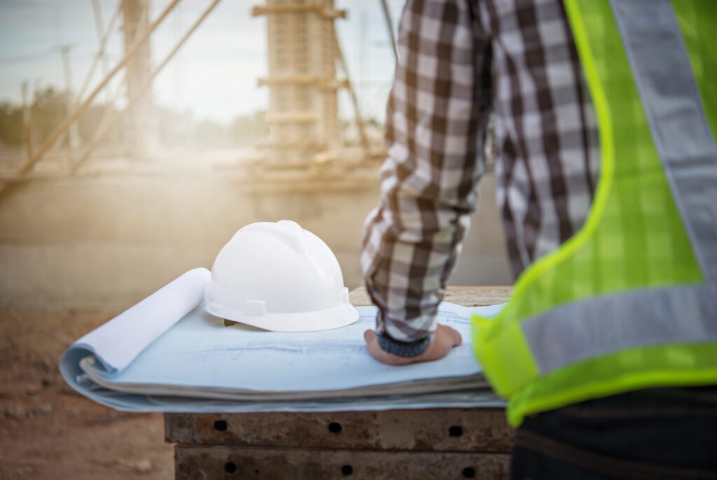 a construction worker wearing a hard hat and hard hat.