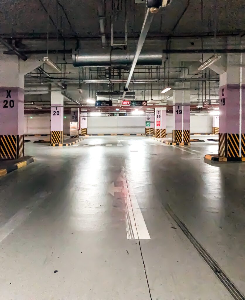 a parking garage with a lot of empty spaces.