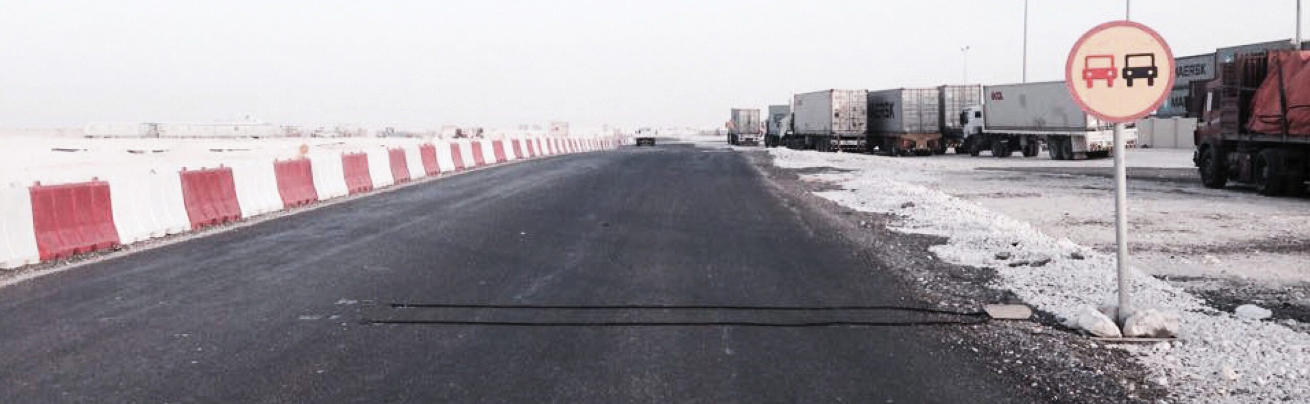 a truck is parked on the side of a road.