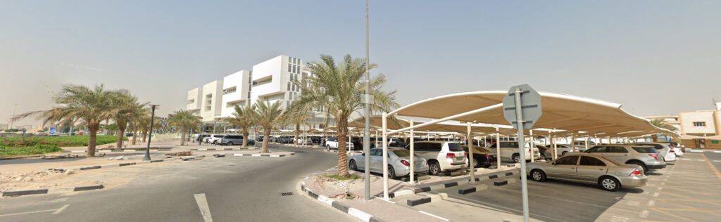 a view of a parking lot with cars parked in it.