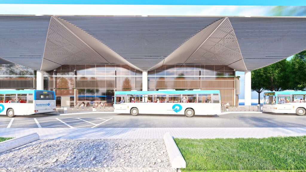 two buses are parked in front of a building.
