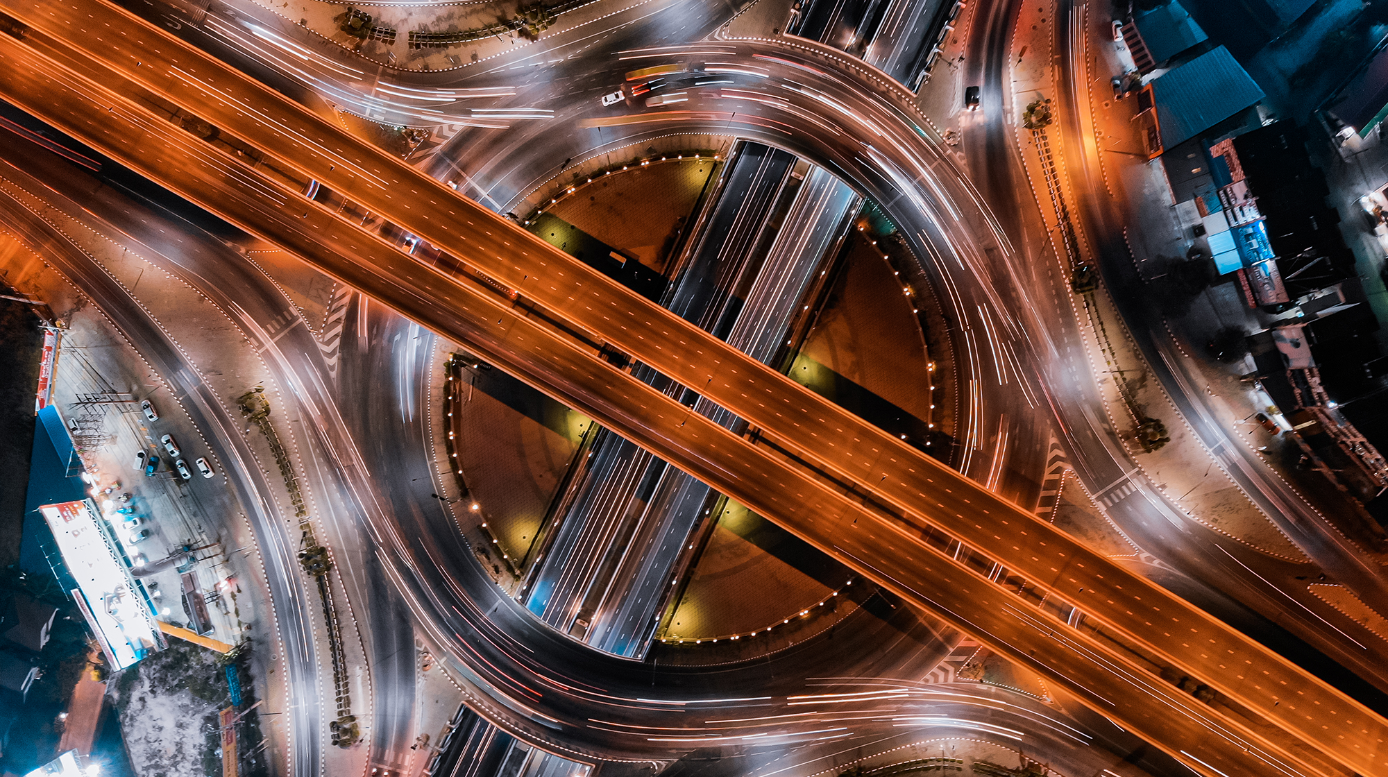 an aerial view of a city intersection at night.