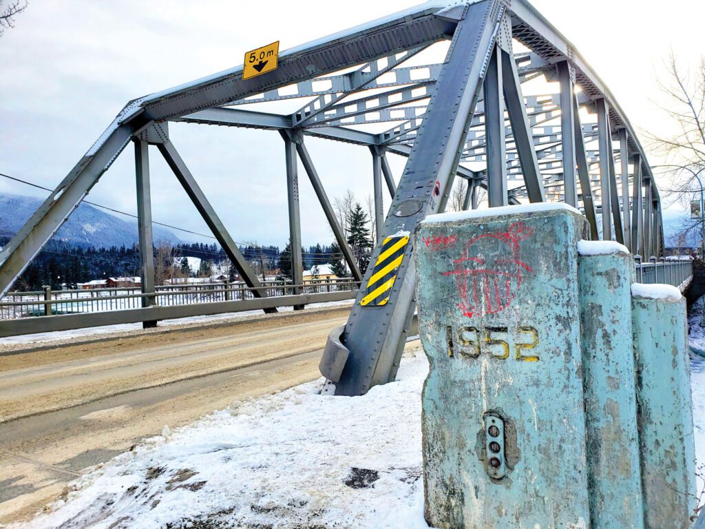 A picture of the existing Kicking Horse Bridge showing signs of deterioration and corrosion.